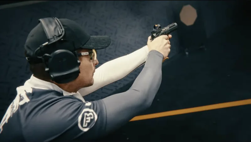 Eric Grauffel, nine-time IPSC World Champion, preparing to shoot the CZ TS 3 Orange at the EG CZ Academy range