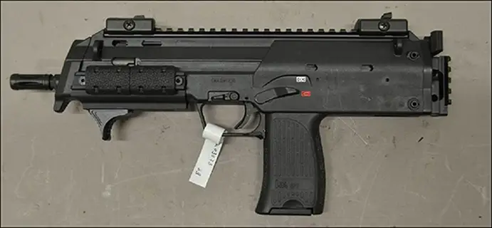 HK SP7 semi-automatic pistol, left side view, from the official BKA determination document showing the stockless civilian MP7 variant with evidence tag