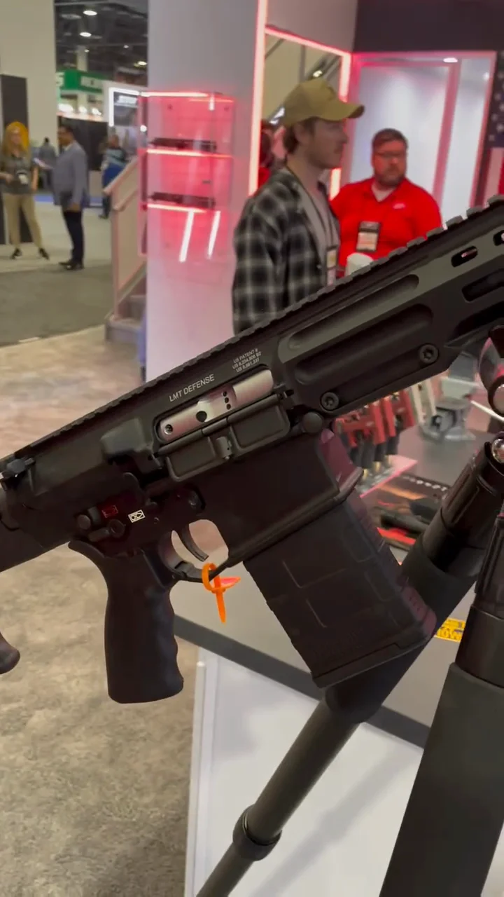 LMT DMR upper receiver showing LMT Defense branding and lightweighting features