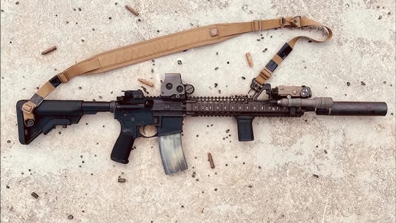 Block II SOPMOD clone with Daniel Defense RIS II quad rail, EOTech, PEQ-15 laser, suppressor, and sling