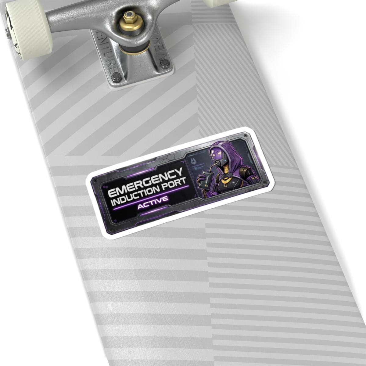 May include: A rectangular sticker with the text "EMERGENCY INDUCTION PORT ACTIVE" in white and purple. The sticker features a purple and black illustration of a futuristic character. The sticker is on a skateboard.