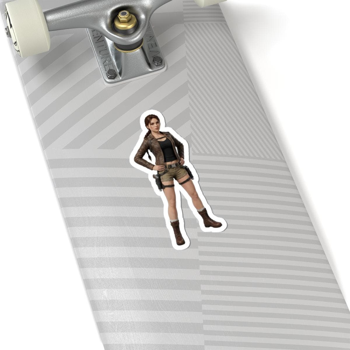 May include: A sticker featuring a character in a brown leather jacket, black top, khaki shorts, and brown boots. The character is posed with hands on hips. The sticker is on a skateboard.