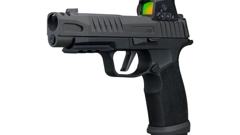 SIG Sauer P365-FUSE COMP from the left front showing the slide-integrated expansion chamber, compensator ports, and aggressive FUSE serrations