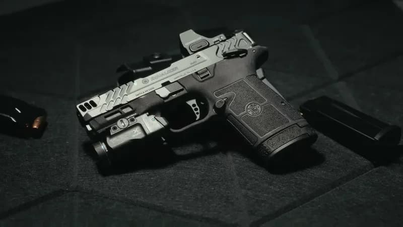 Smith & Wesson Equalizer Carry Comp with mounted red dot optic and Streamlight TLR-7 Sub weapon light