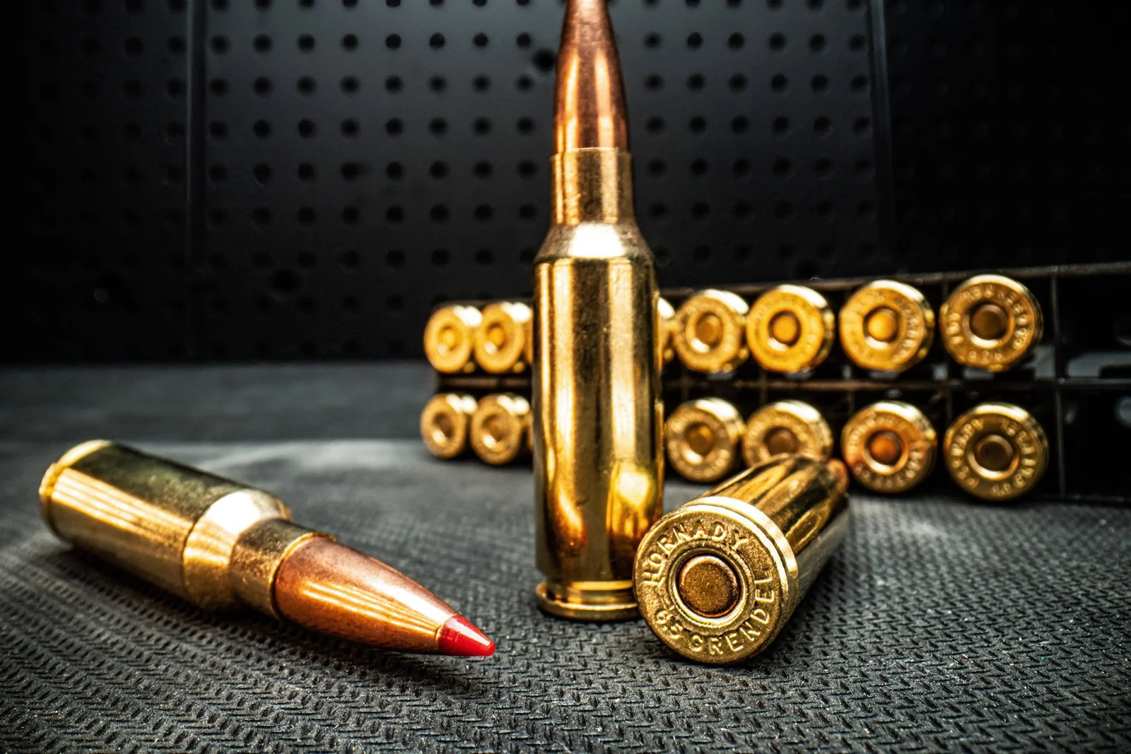 Hornady 6.5 Grendel cartridges with the headstamp reading HORNADY 6.5 GRENDEL, staged with a loaded ammunition tray