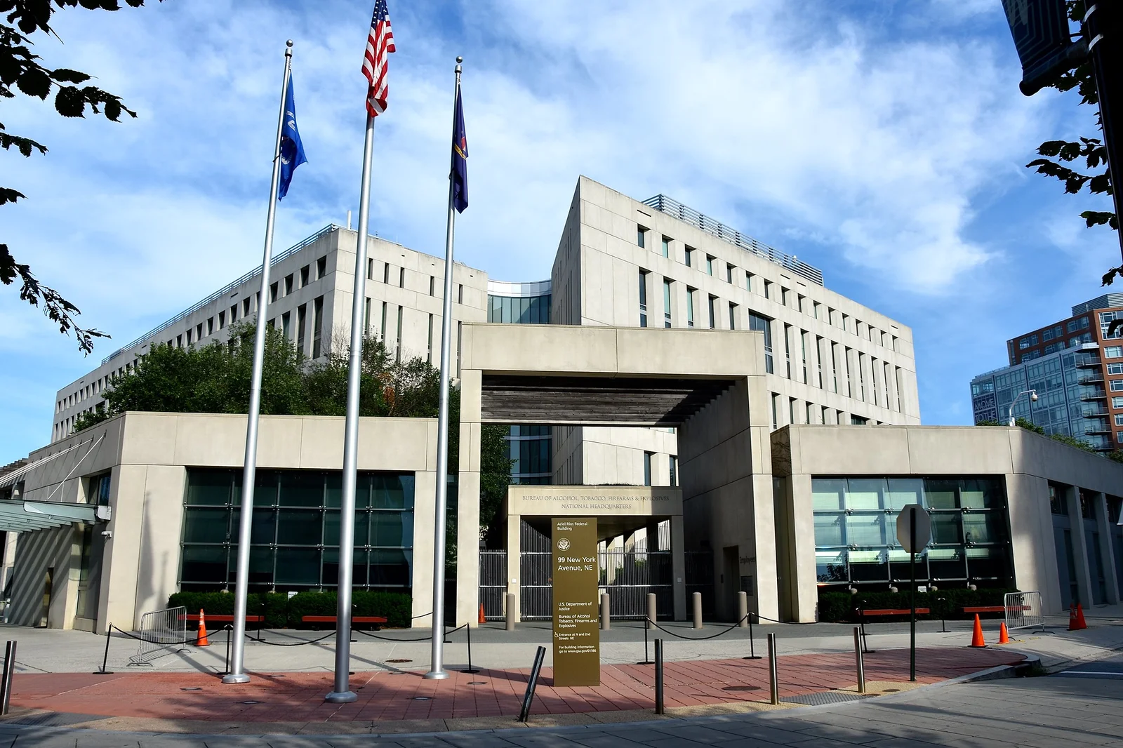 The Ariel Rios Federal Building at 99 New York Avenue NE in Washington, DC, national headquarters of the Bureau of Alcohol, Tobacco, Firearms and Explosives, with flags flying out front