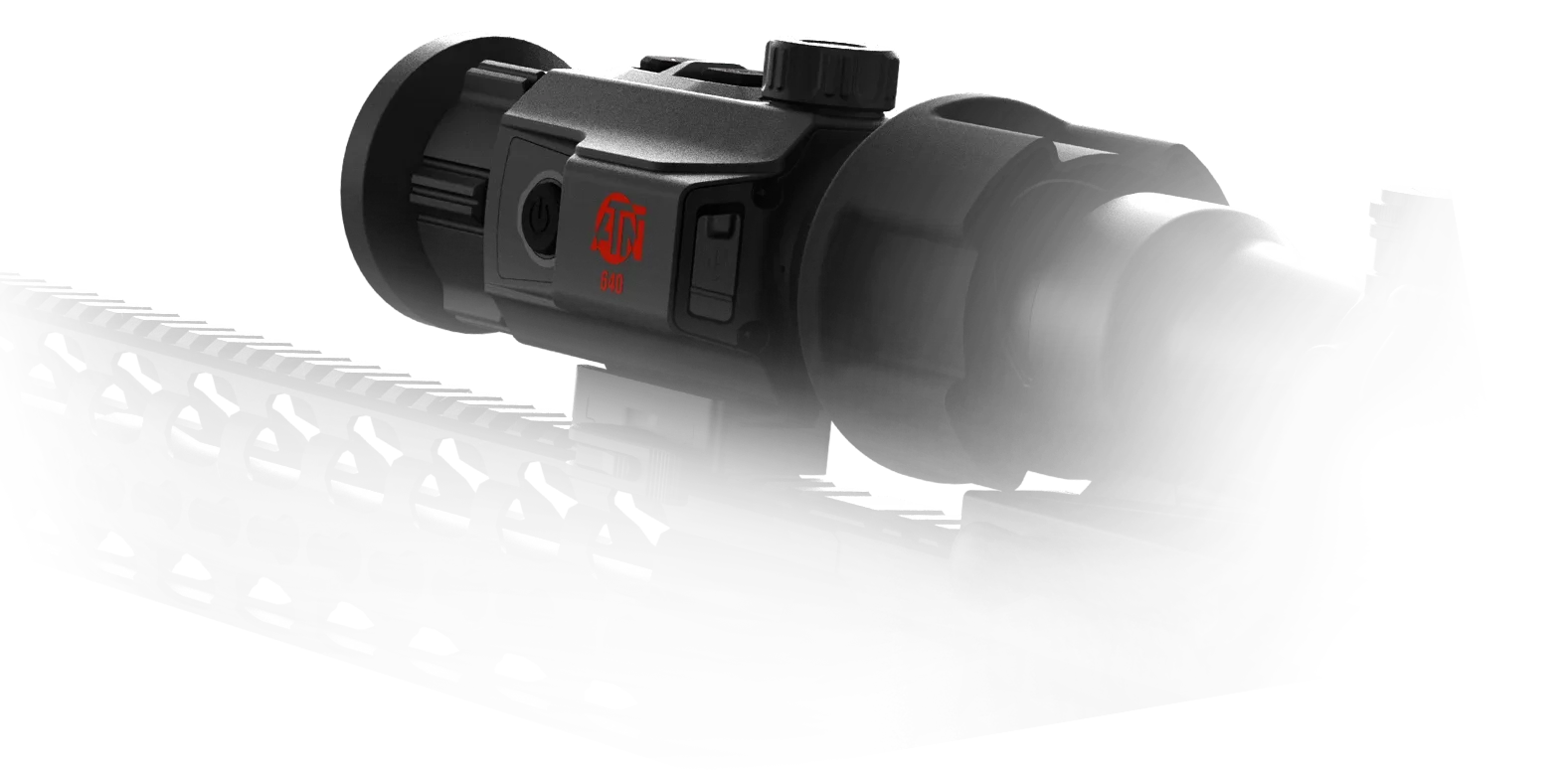 ATN TICO 6 thermal clip-on with glowing red ATN logo, mounted on a firearm Picatinny rail in low-key studio lighting