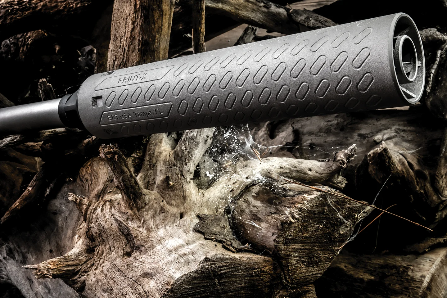 Close-up of a B&T Print-X 3D-printed suppressor mounted on a rifle barrel
