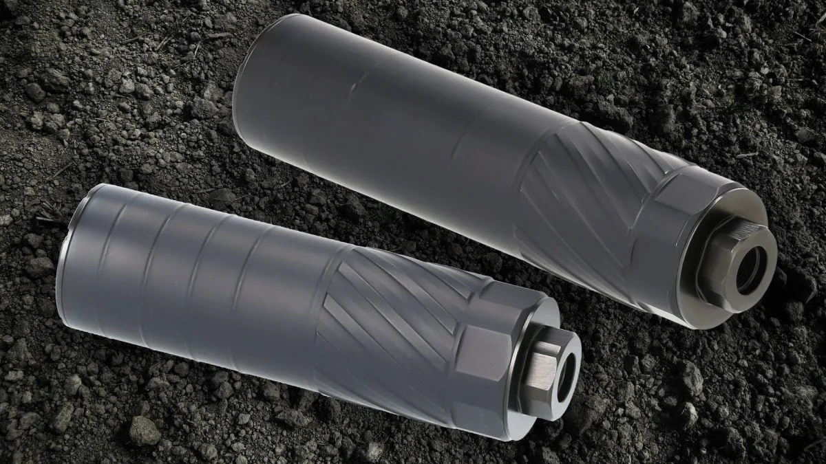 Canik VOID-9 titanium 3D-printed pistol suppressor resting on gravel showing the swirl texture characteristic of printed titanium