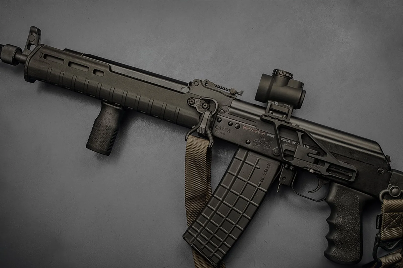 AK-pattern rifle with an OKP-7 style red dot mounted on the side rail
