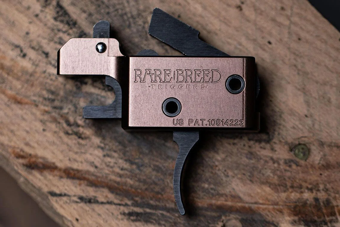 Rare Breed Triggers FRT-15 forced reset trigger module, copper-colored housing with US patent marking