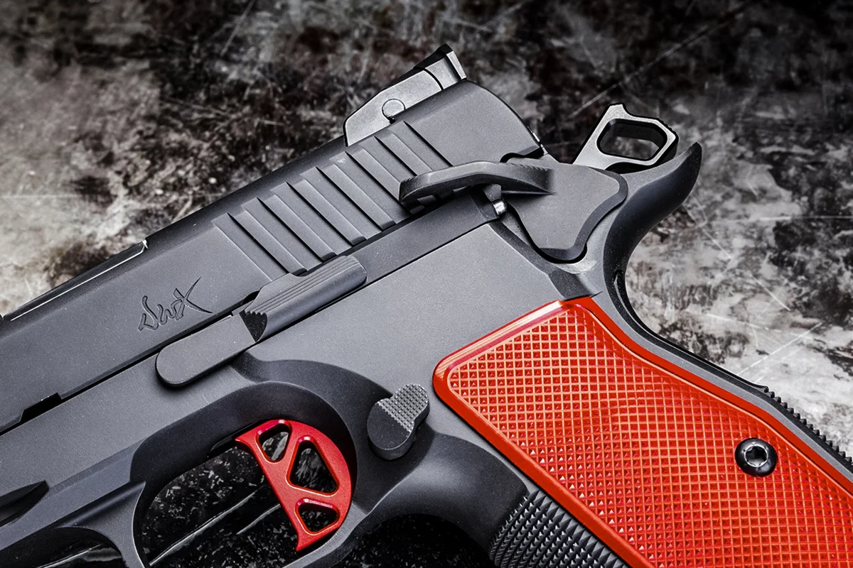 Close-up of the Dan Wesson DWX flat single-action trigger and ambidextrous 1911-style thumb safety