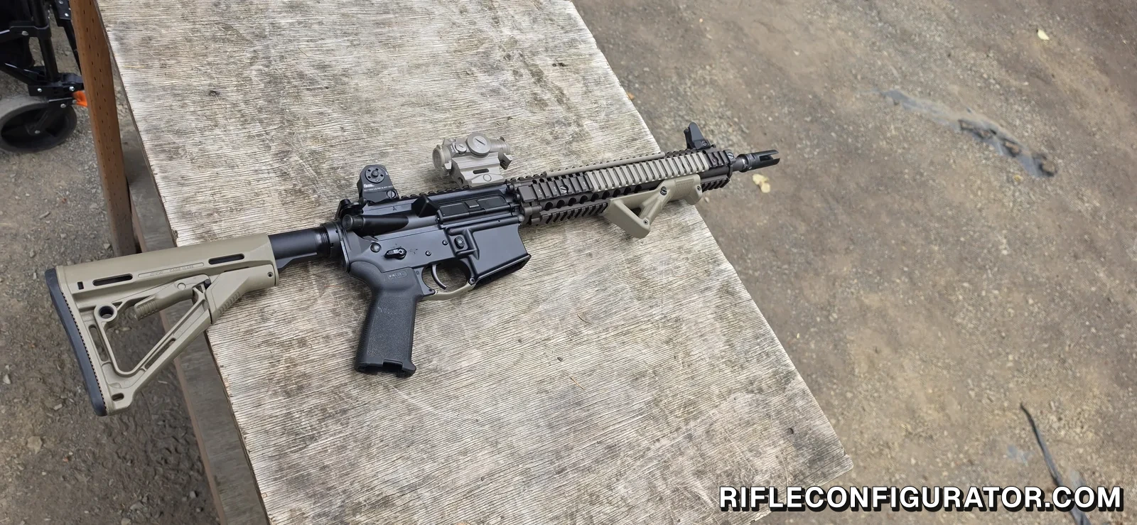 Daniel Defense Block II carbine on an outdoor range bench in right side profile with an FDE RIS II quad rail, a micro red dot on the receiver rail, an angled foregrip, and a Magpul CTR stock