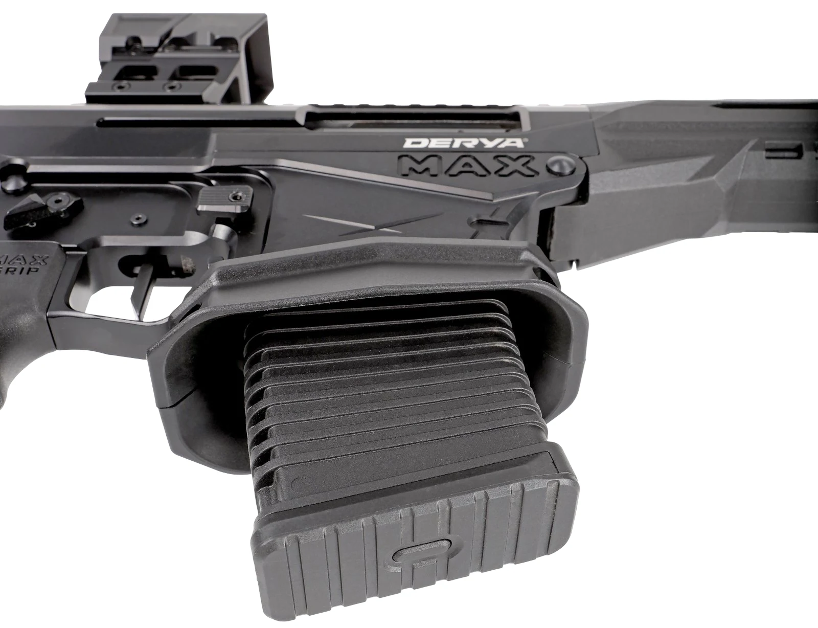 Close-up of the Derya MAX flared magwell with a proprietary polymer magazine seated, showing the MAX GRIP pistol grip and receiver markings