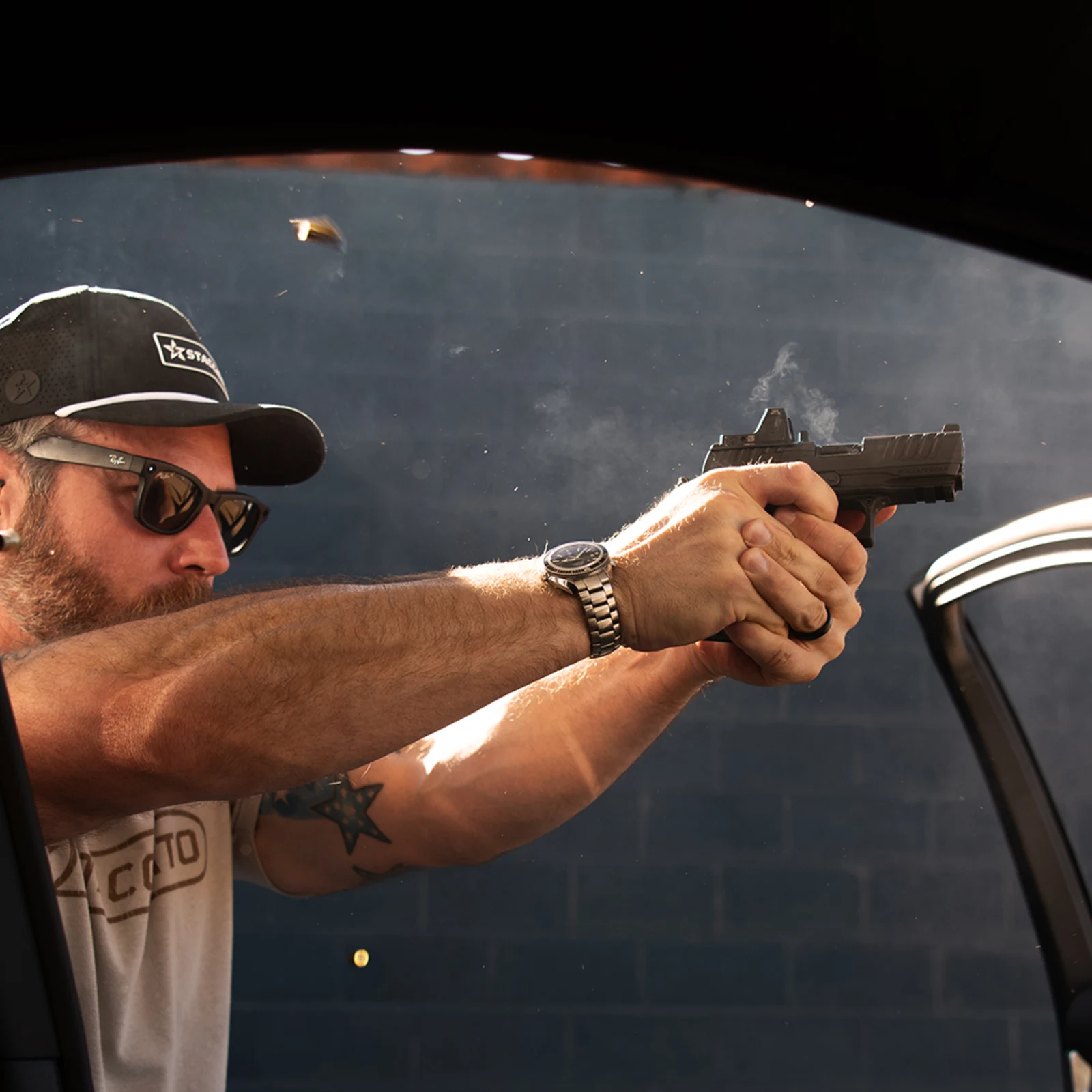 Staccato HD C3.6 firing at a range with a slide-mounted red dot