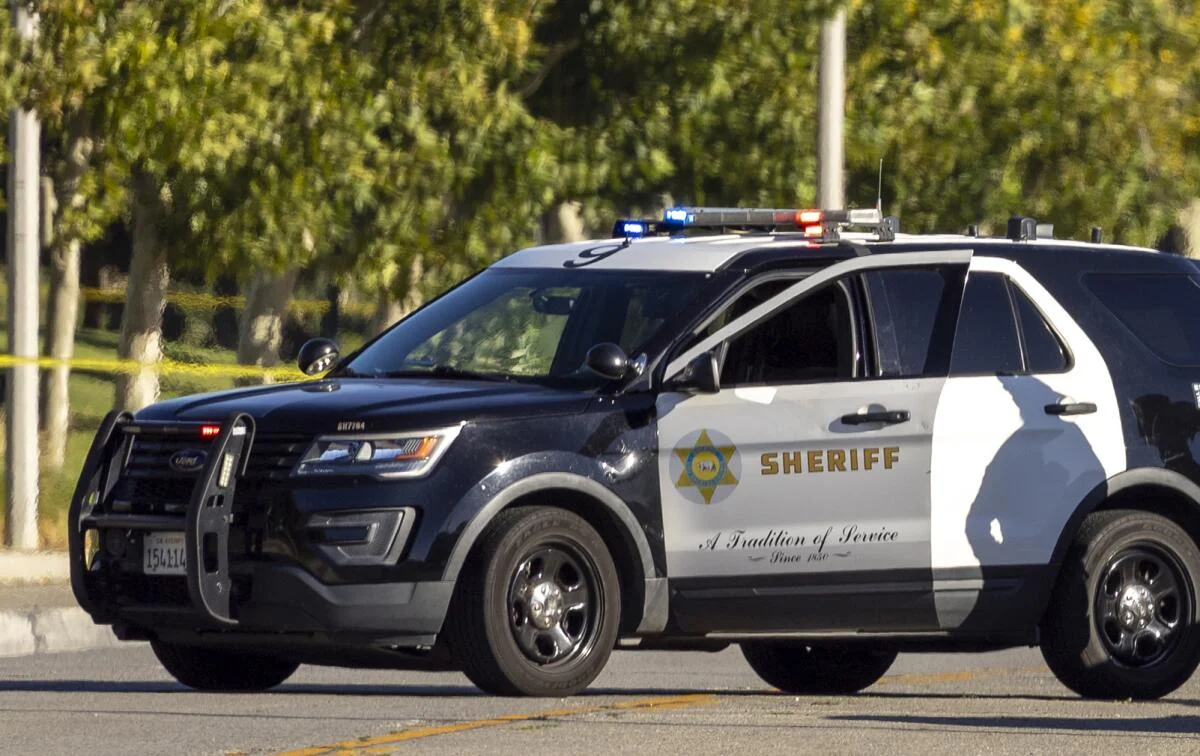 Los Angeles County Sheriff's Department patrol SUV with the department's gold star and A Tradition of Service markings