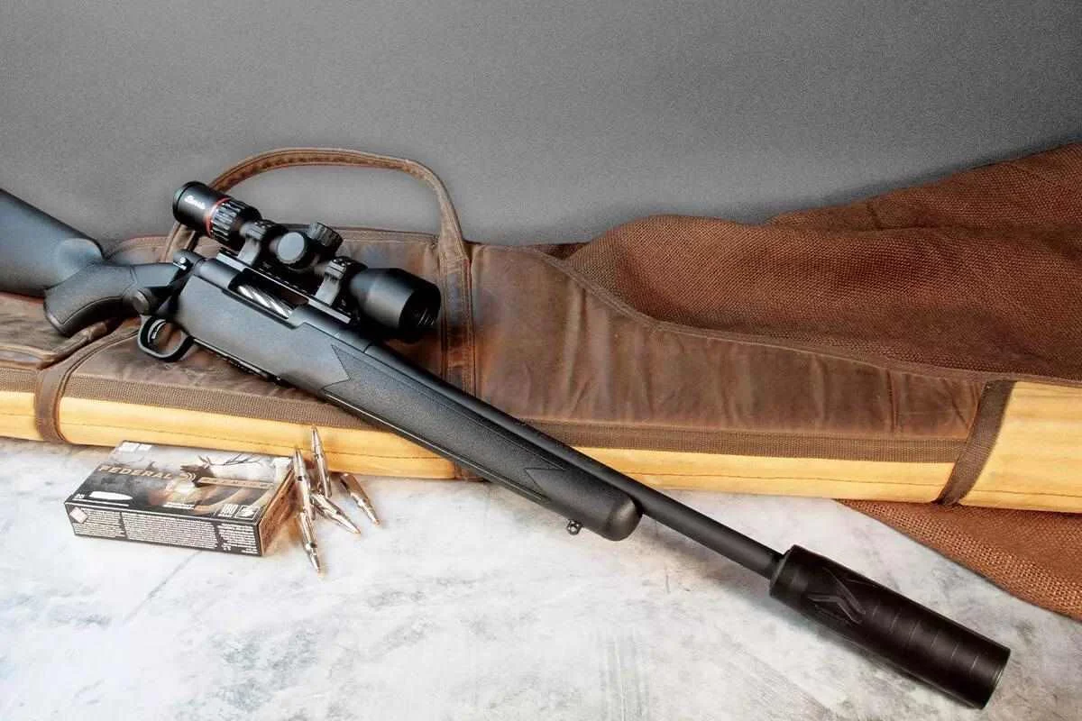 A suppressor mounted on a precision rifle barrel