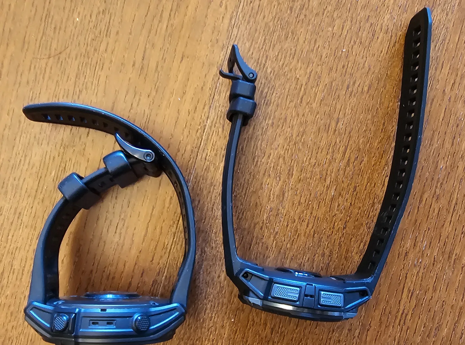 Side profile of the Garmin Instinct 3 AMOLED showing its slim case, next to the bulkier tactix