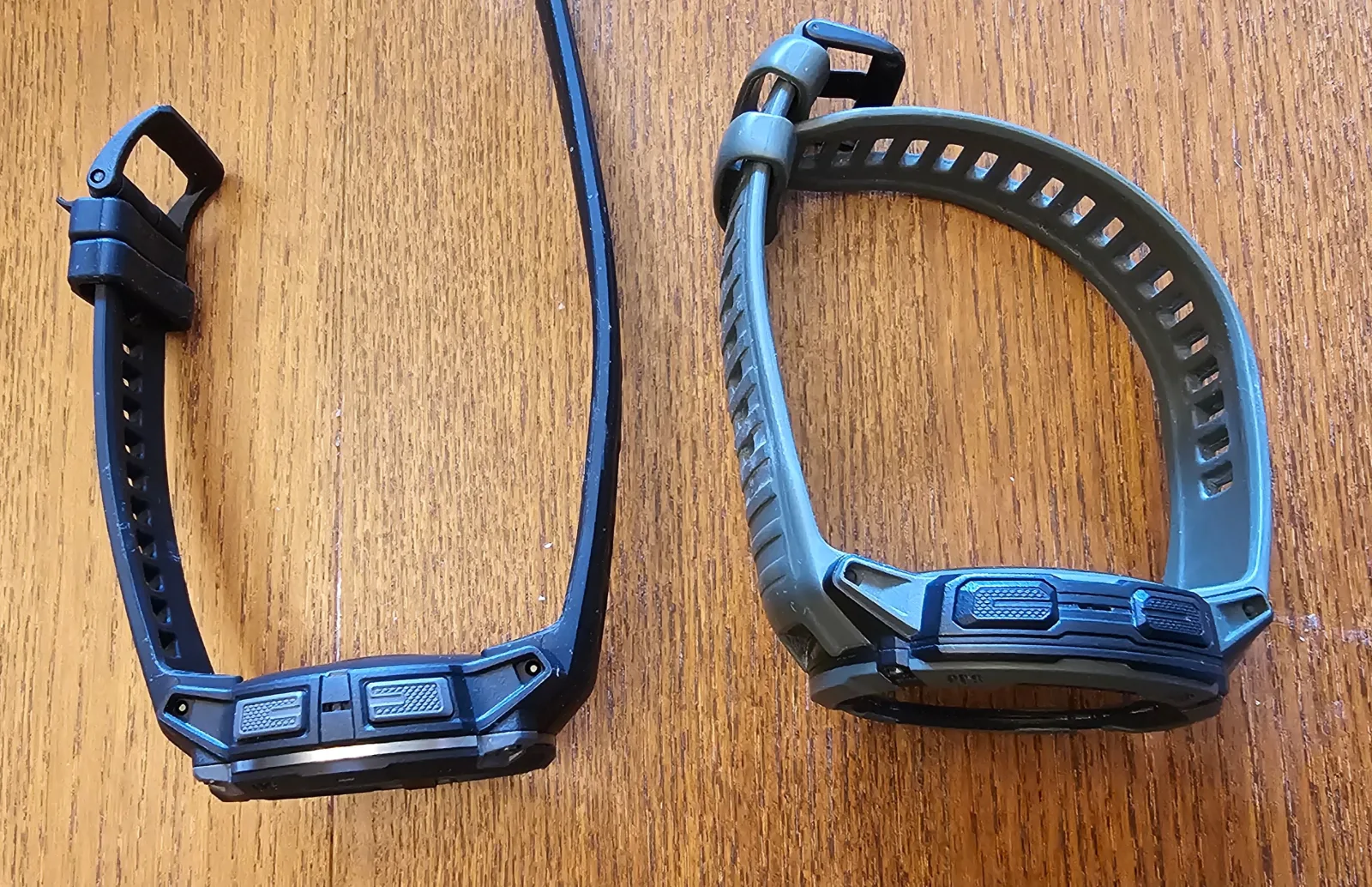 Garmin Instinct 3 AMOLED 45mm on the left next to the larger tactix 7 AMOLED on the right, showing the size difference