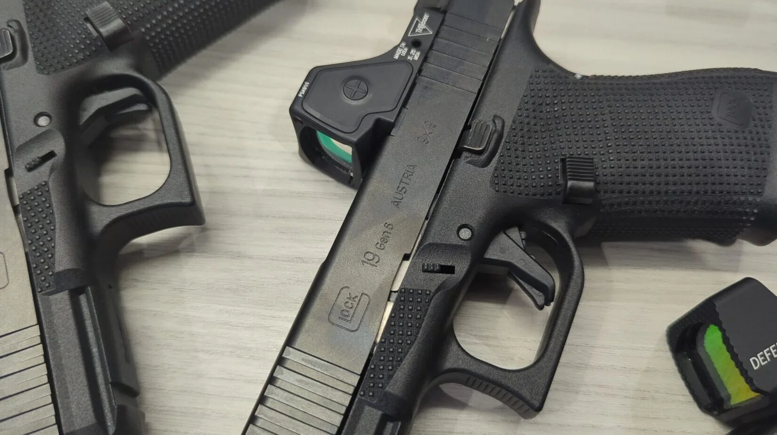 Glock Gen6 frame showing RTF6 grip texture, palm swell, undercut trigger guard, and flat-faced trigger