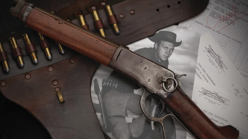 Classic Mare's Leg lever-action pistol with leather belt and Steve McQueen photograph