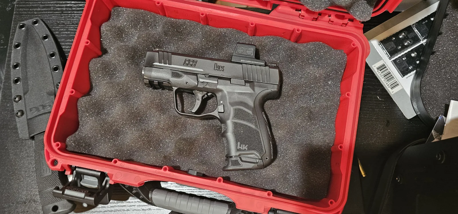 HK CC9 with a Holosun EPS Carry enclosed red dot mounted to the direct-milled slide, top view showing HK markings