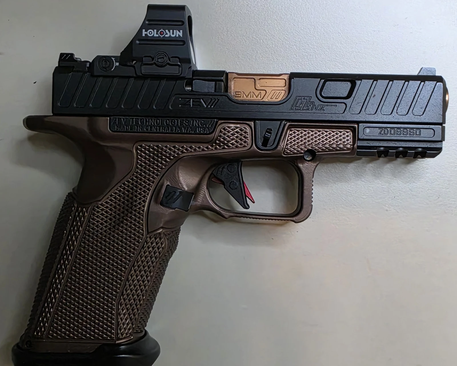 Holosun 507COMP mounted on a bronze ZEV OZ9 V2 Elite Hypercomp, left side profile