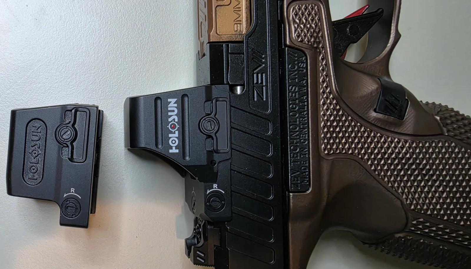 Top-down view of the Holosun 507COMP mounted on the ZEV OZ9 slide beside a Holosun 509T