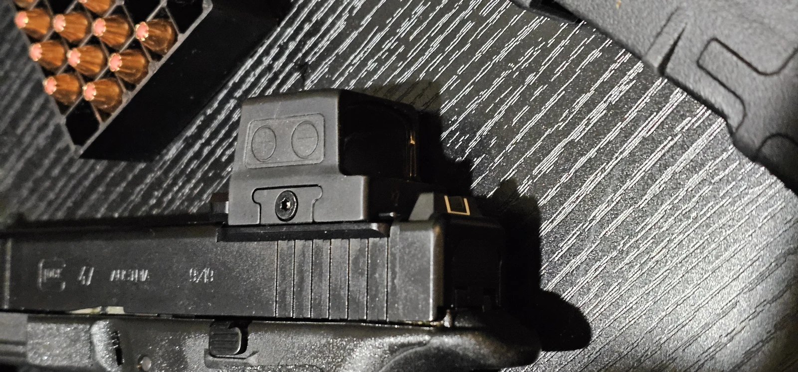 Side profile of the Holosun 509T X2 Gold on a Glock 47 MOS slide showing the adapter plate stack height