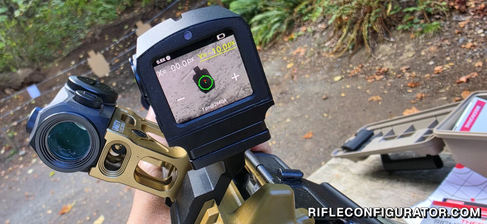 InfiTac FMP13 zeroing screen reading X 00.0px, Y -10.0px and 1px@2MOA, with a green circle reticle on a cardboard target, beside a Holosun red dot on a Unity mount