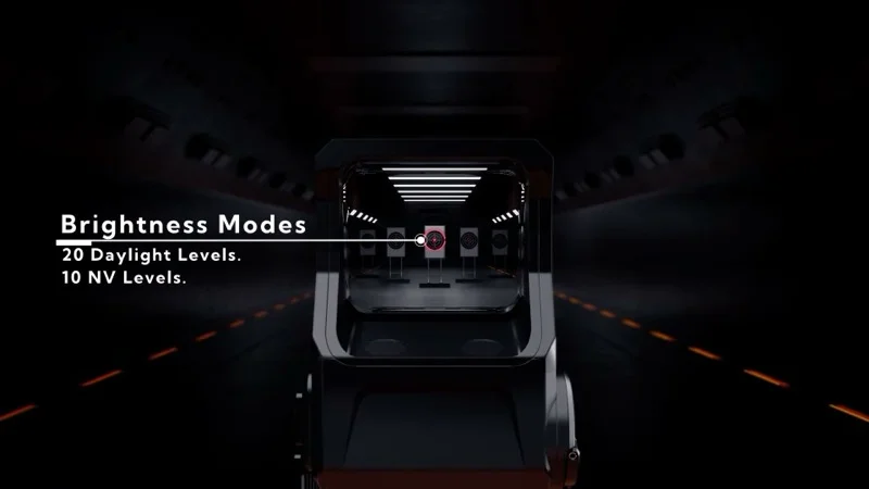 INFITAC OWS-32 view through the sight showing the reticle centered in a 1.26 x 1.0 inch waveguide viewing window with brightness mode indicator