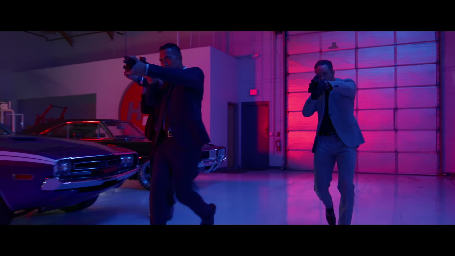 Two operators advancing with KelTec MP50s in KelTec promotional video