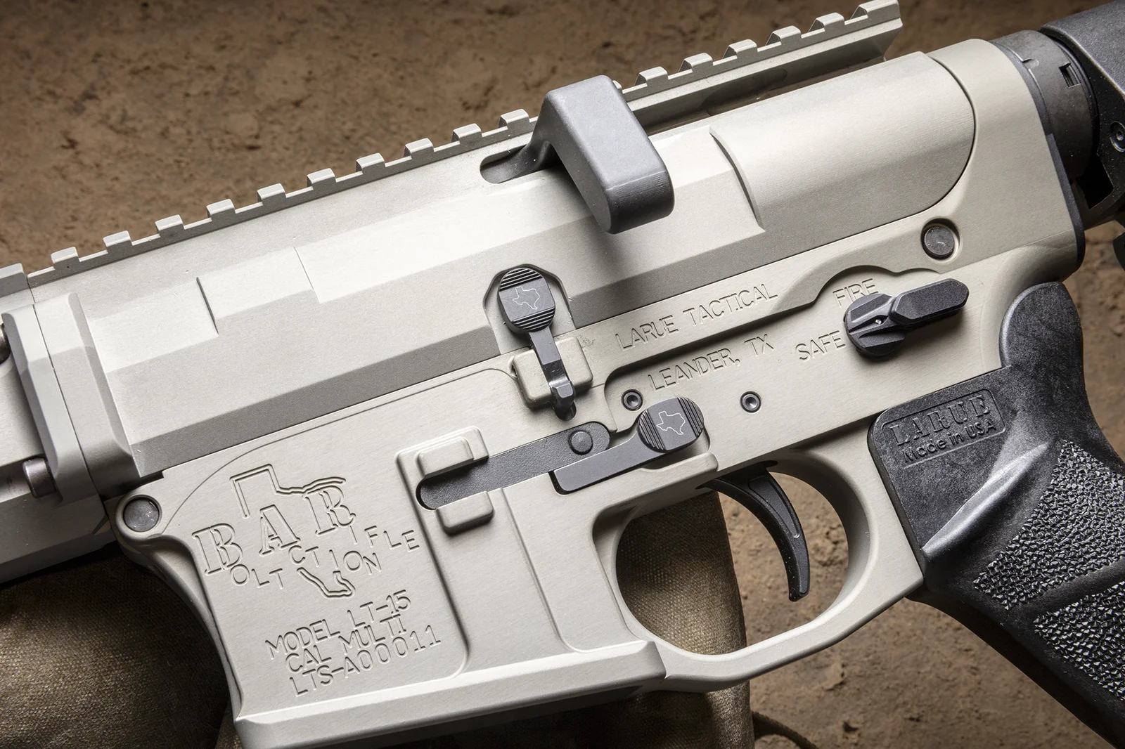 LaRue BAR*NONE receiver with side-charging bolt handle and Texas-themed markings, CNC-machined in Leander, Texas