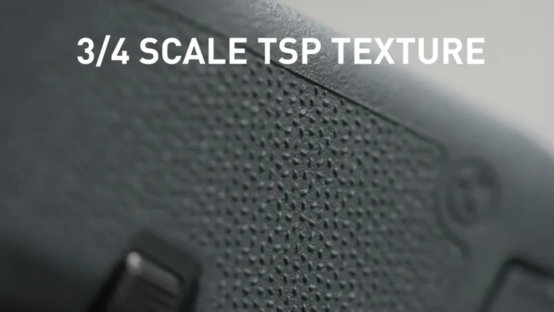 Macro detail of the 3/4 scale Magpul TSP texture on the EHG RG380 grip showing the trapezoidal surface projection pattern and EHG branding