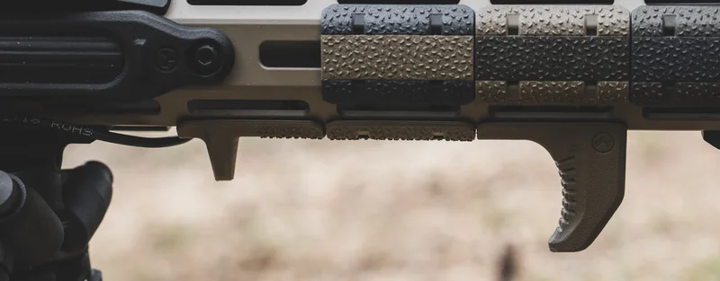 Magpul M-LOK Hand Stop Kit and rail covers on a rifle handguard