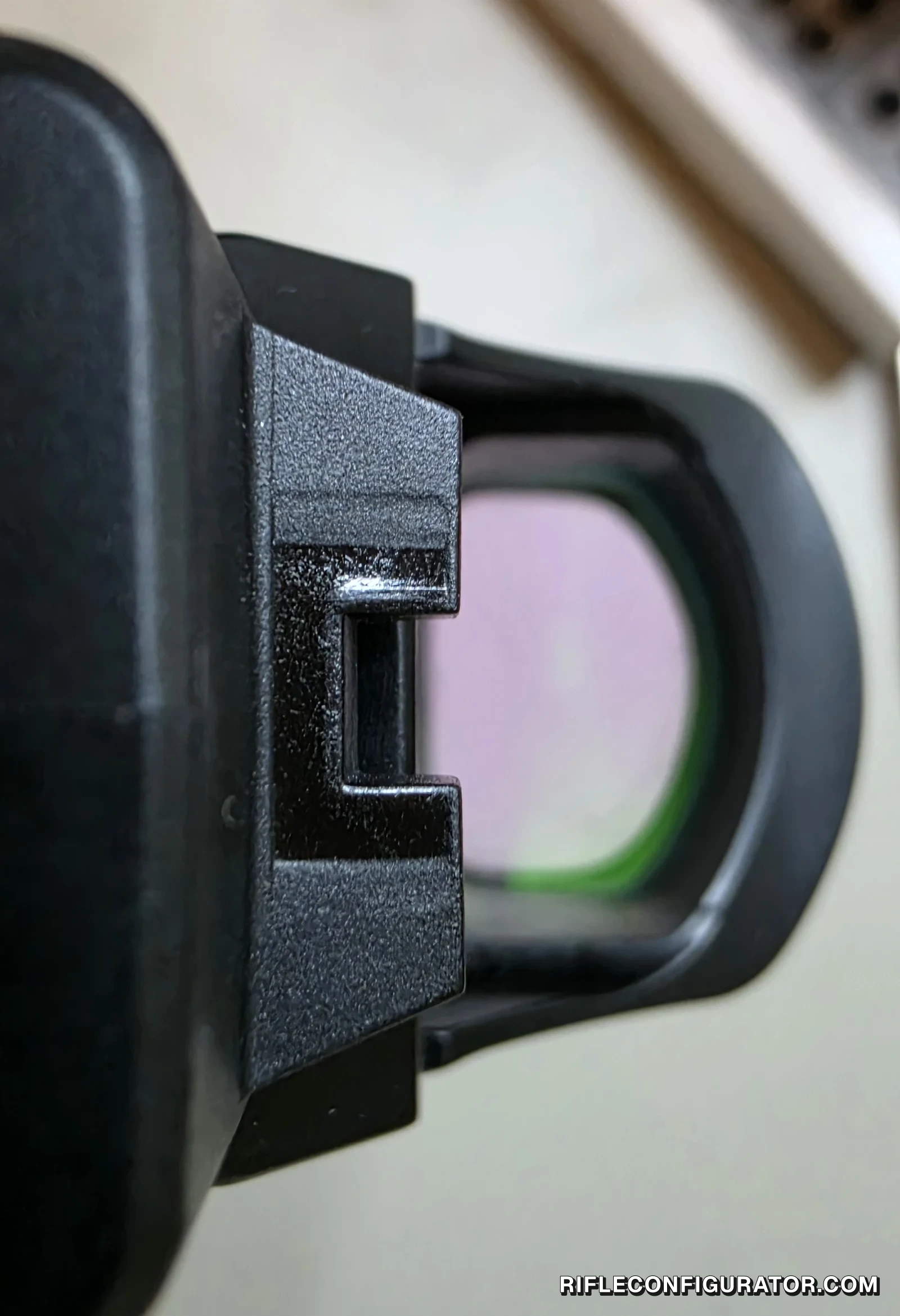 View from behind the Mantis TitanX slide showing the molded rear iron sight at the edge of the Holosun 507C window