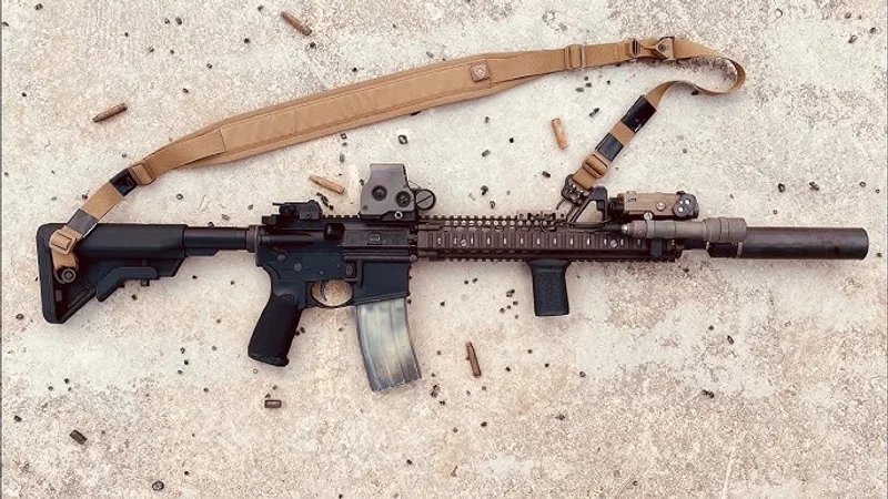 Block II SOPMOD clone with Daniel Defense RIS II quad rail, EOTech, PEQ-15 laser, suppressor, and sling