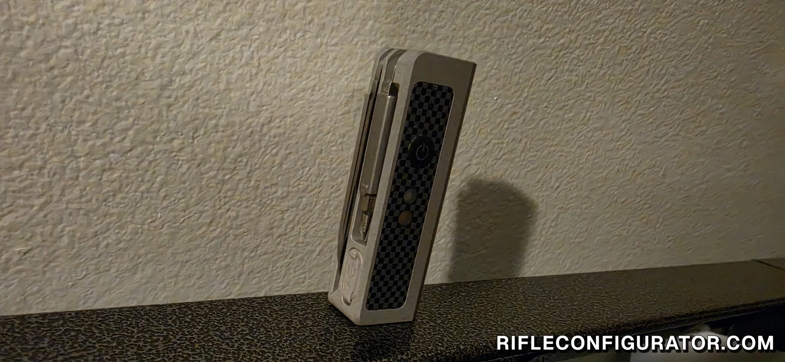 OKNIFE MK standing upright on a steel shelf, held by its magnetic base