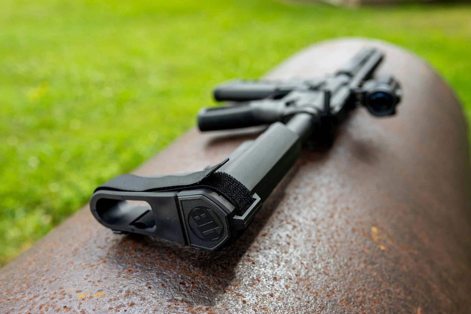 Close-up of an SB Tactical SBA3 brace on a One Horse Express 10.5 M-LOK pistol outdoors on rusted metal