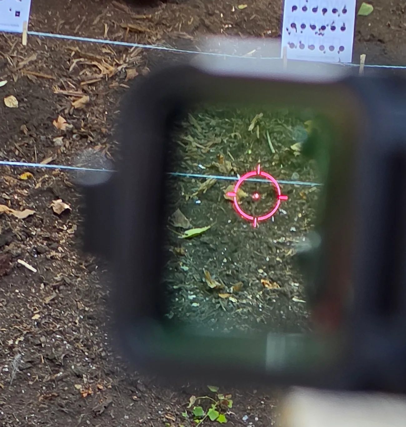 View through the Osight R showing the 65 MOA circle and 2 MOA center dot centered in the window