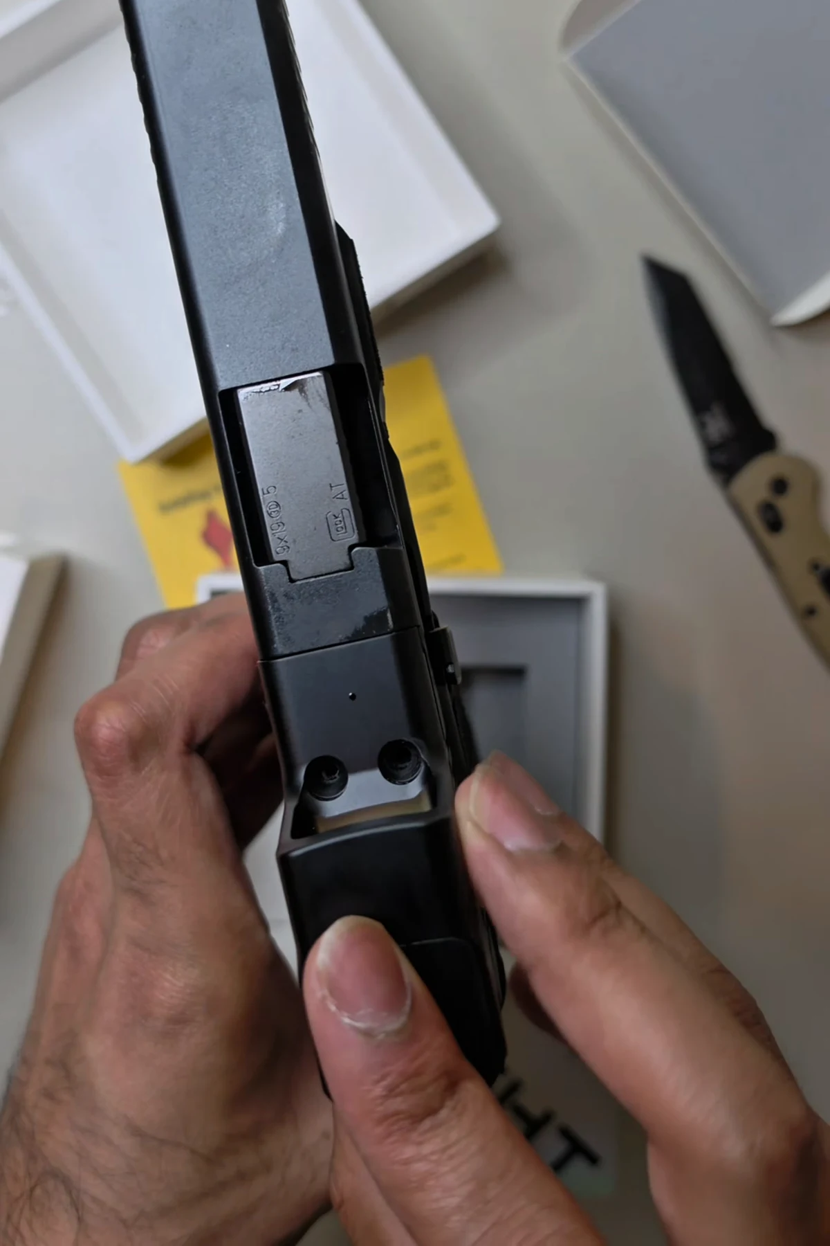 Bare Glock 47 MOS slide cut showing the two threaded mounting posts before the Osight SE MOS is installed