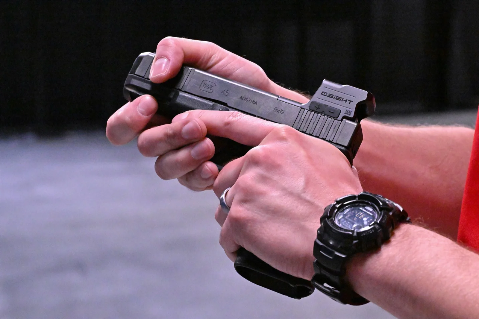 Osight SE MOS mounted on a full-size Glock 45 MOS slide, showing the front window and the side brightness buttons