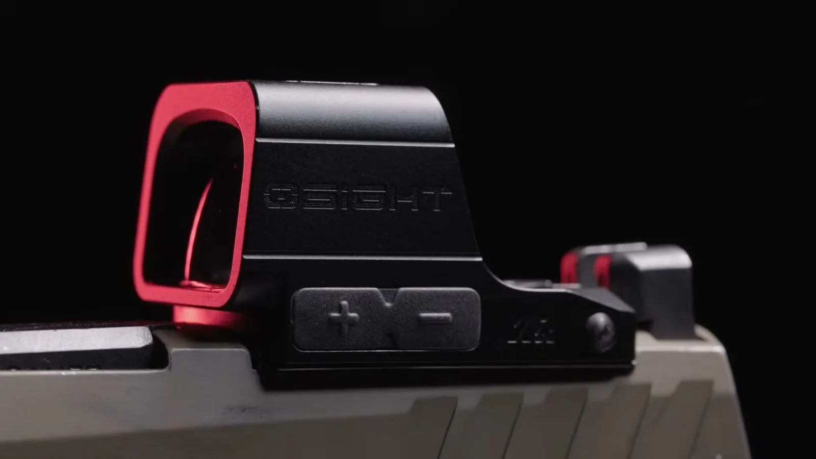 Osight XE AMRS enclosed red dot mounted on a competition pistol slide, showing the side-loading battery tray and elevation controls