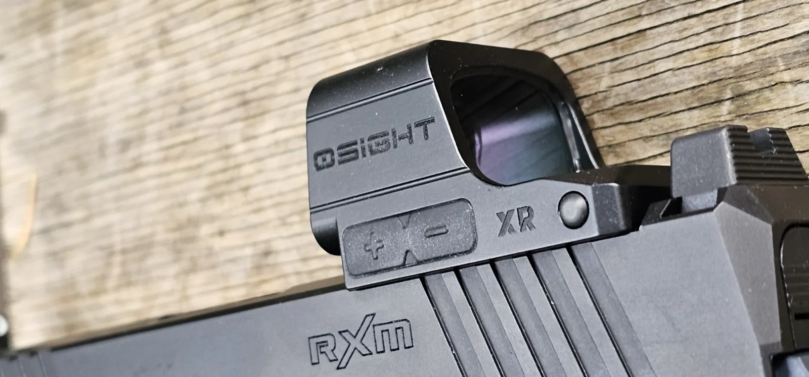 Osight XR mounted on a Ruger RXM slide, showing the brightness rocker and side profile