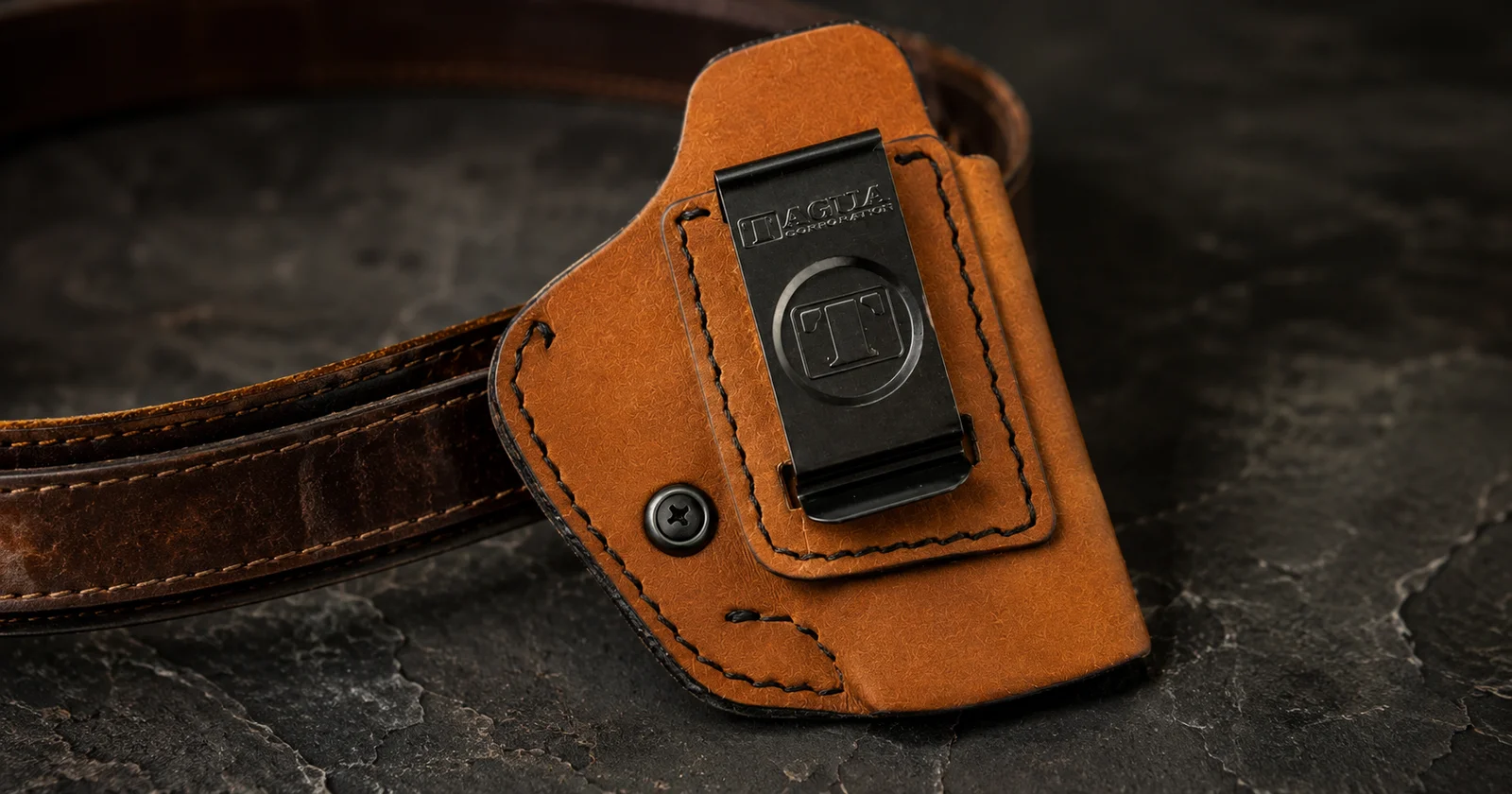 Concealed carry pistol in inside-the-waistband holster on belt