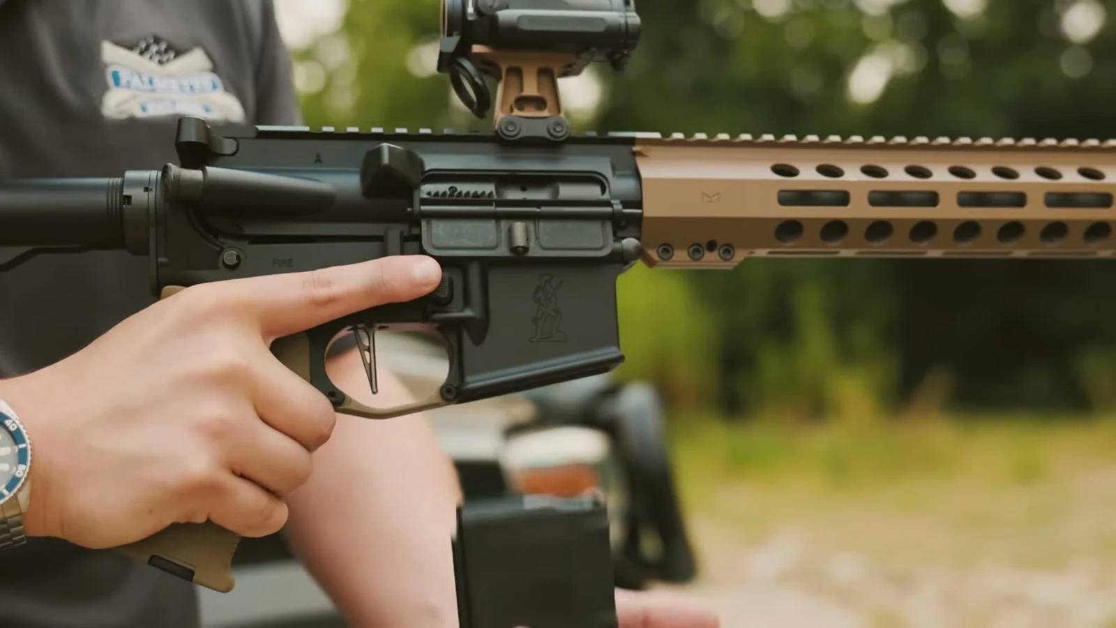 Right side close-up of a PSA California-configured AR-15 lower receiver showing the magwell, PSA logo, and magazine release