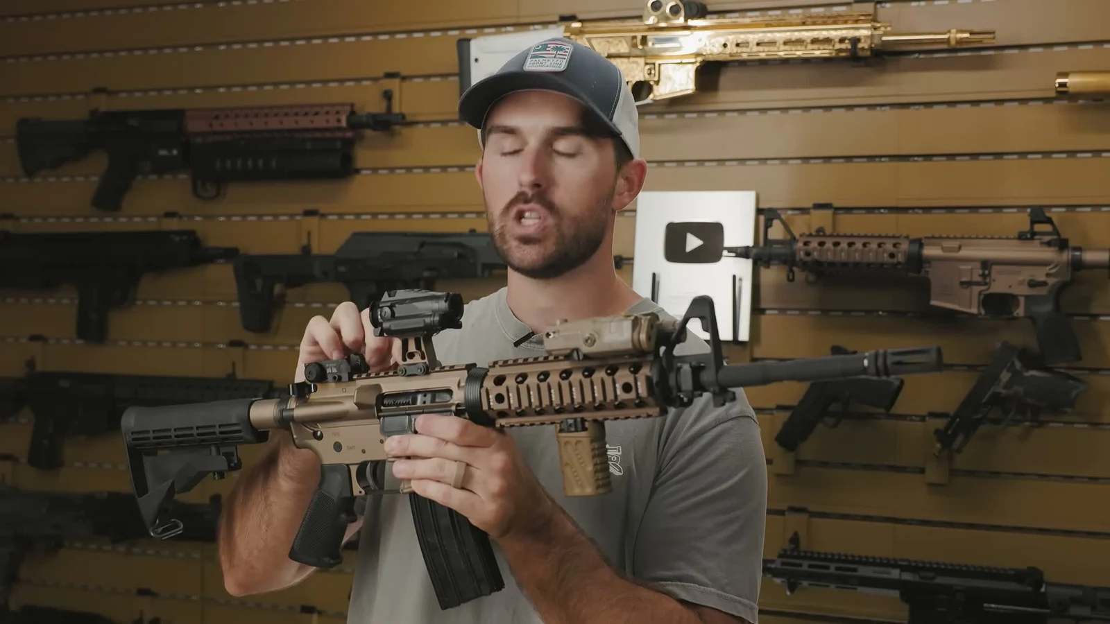 Tan PSA Sabre M4A1 with a red dot optic mounted on the top rail and a tan True North Concepts vertical grip on the quad rail