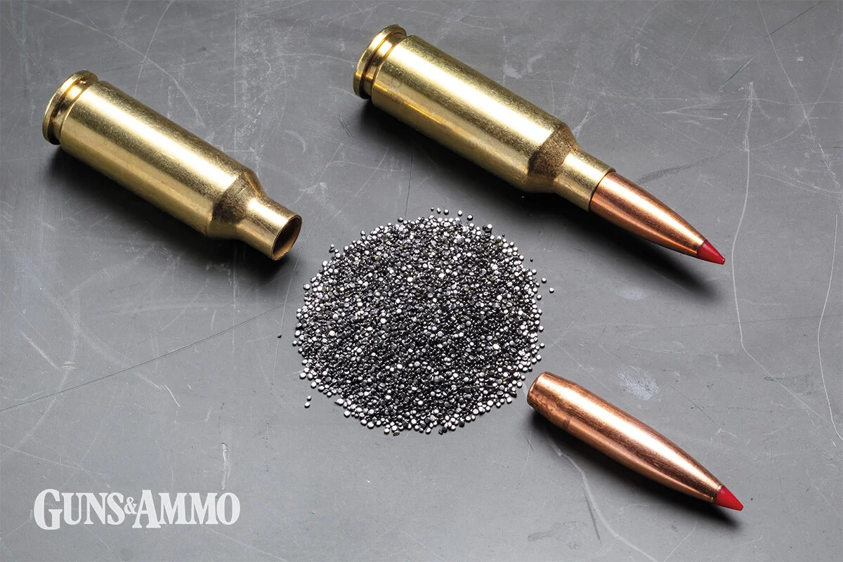 6mm ARC ammunition cartridge shown with components including brass case, powder, and bullets on dark background