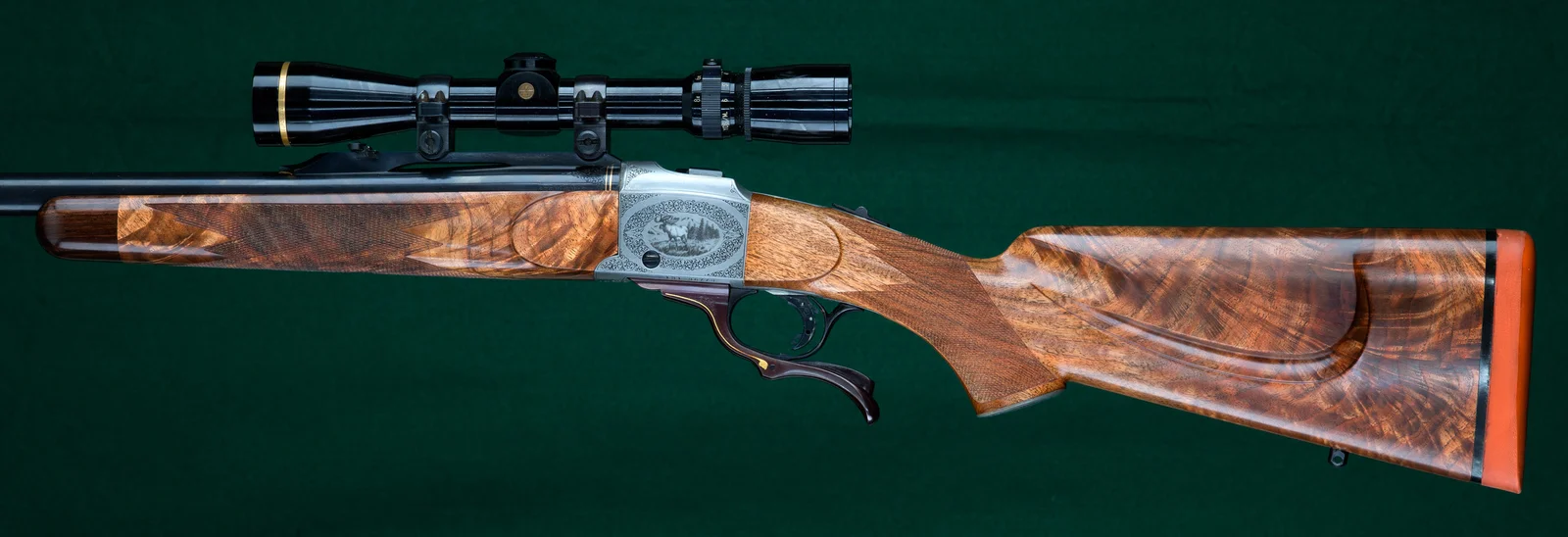 Engraved Ruger No. 1 single-shot rifle with high-grade walnut stock and detailed receiver engraving, representative of the 250th Anniversary commemorative configuration