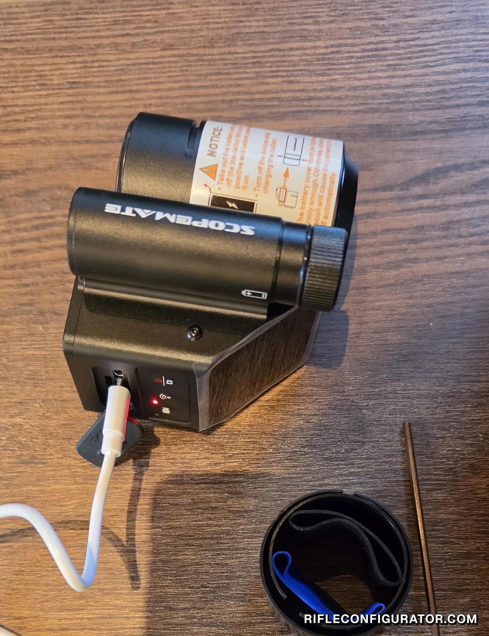 ScopeMate S28-TSC Max charging over a USB-C cable on a table, with the insert case and T-handle hex key beside it